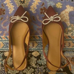 Beautiful deep red women’s flats with imitation crystal bows  barely worn